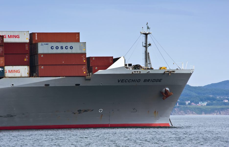 The bow of a huge container ship Vecchio Bridge at anchored in the roads navio cargueiro container barco mar porto importacao exportacao . Nakhodka Bay. East (Japan) Sea. 02.08.2015