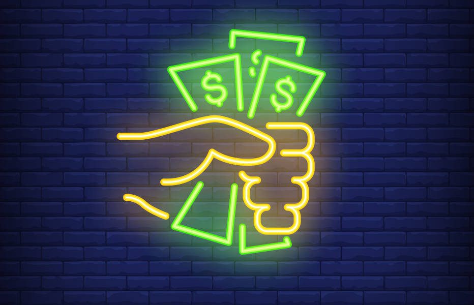 mão segura notas de dinheiro em figura em neon - Crédito: Freepik